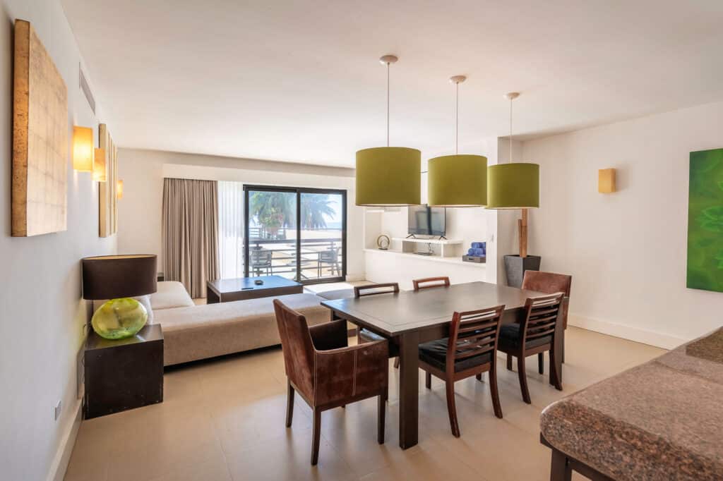 Interior photo of living room and balcony of condo for sale at Aldea Thai